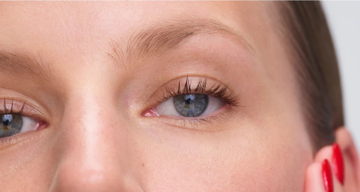 Close-up of a person's eye with a neutral background