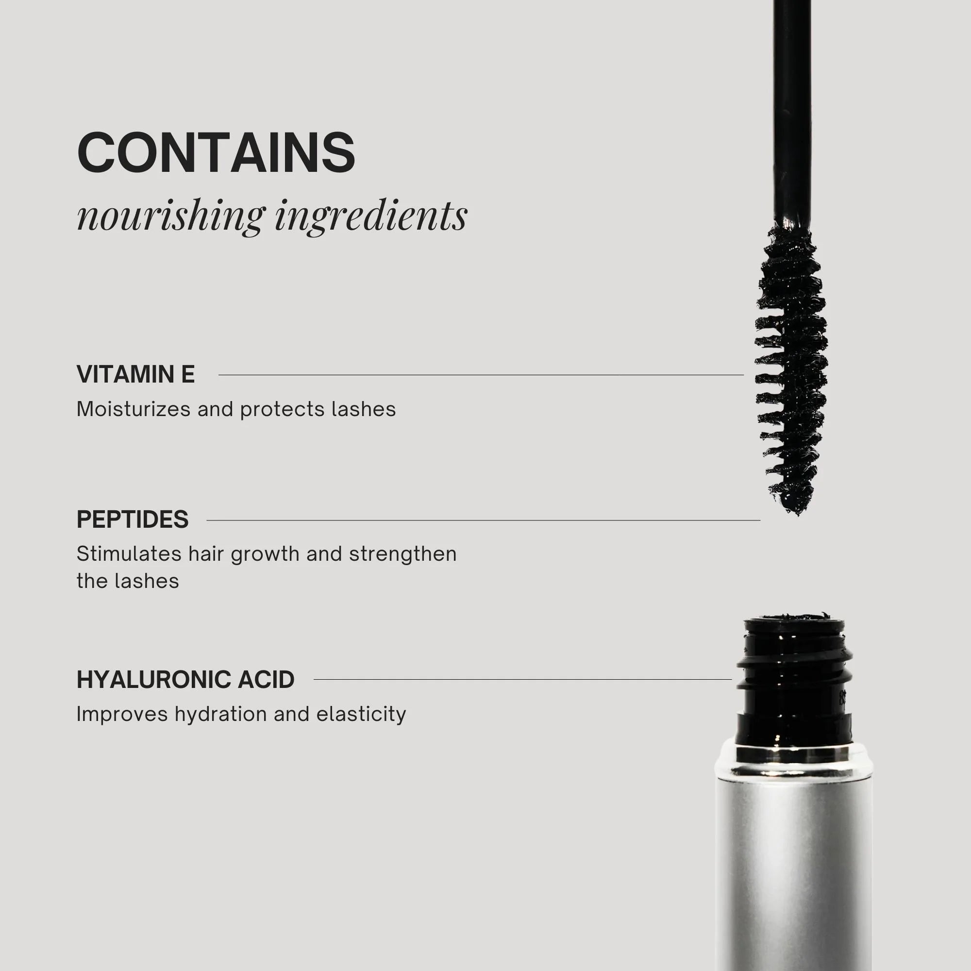 Mascara with a brush and product container on a gray background, featuring nourishing ingredients.