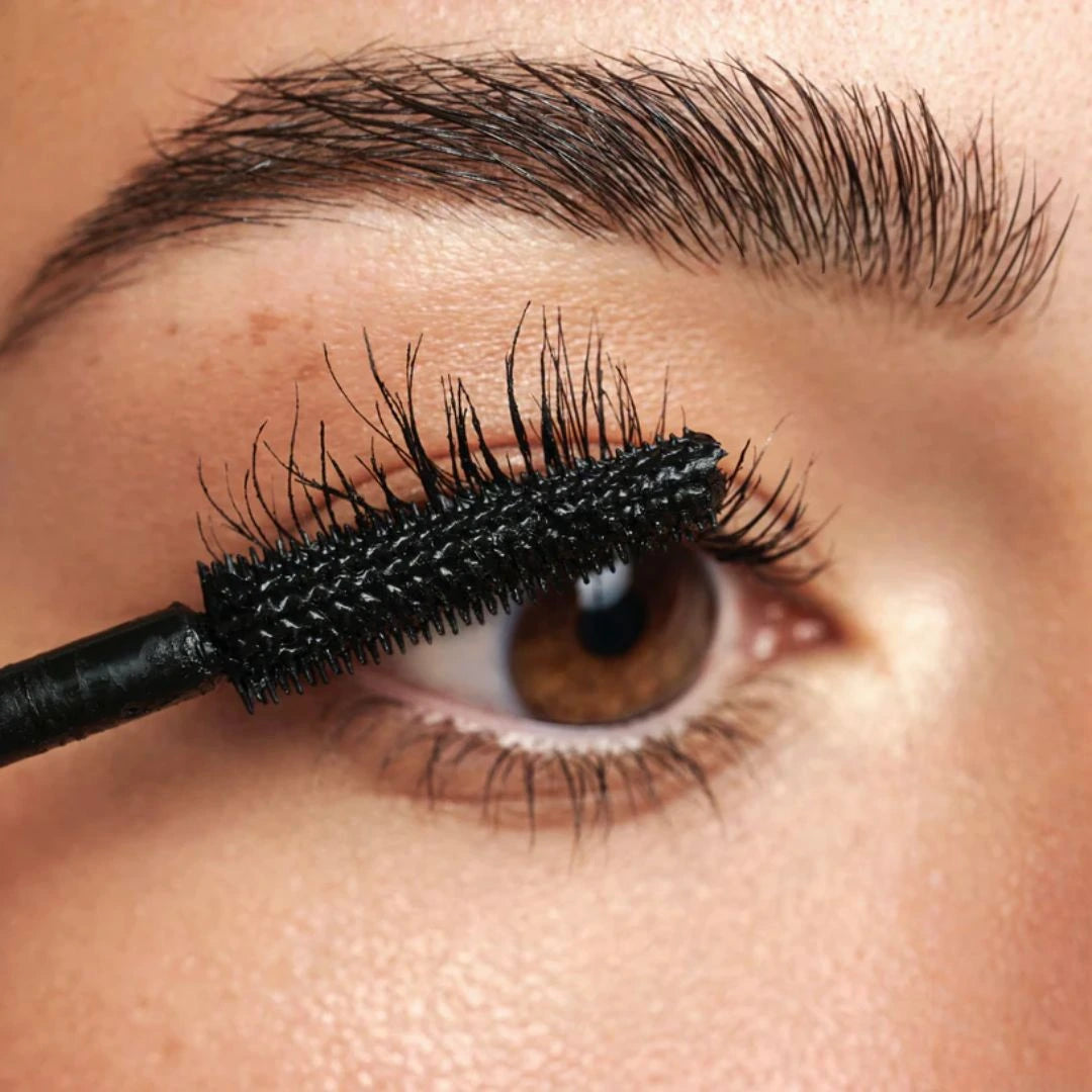 Women applying mascara
