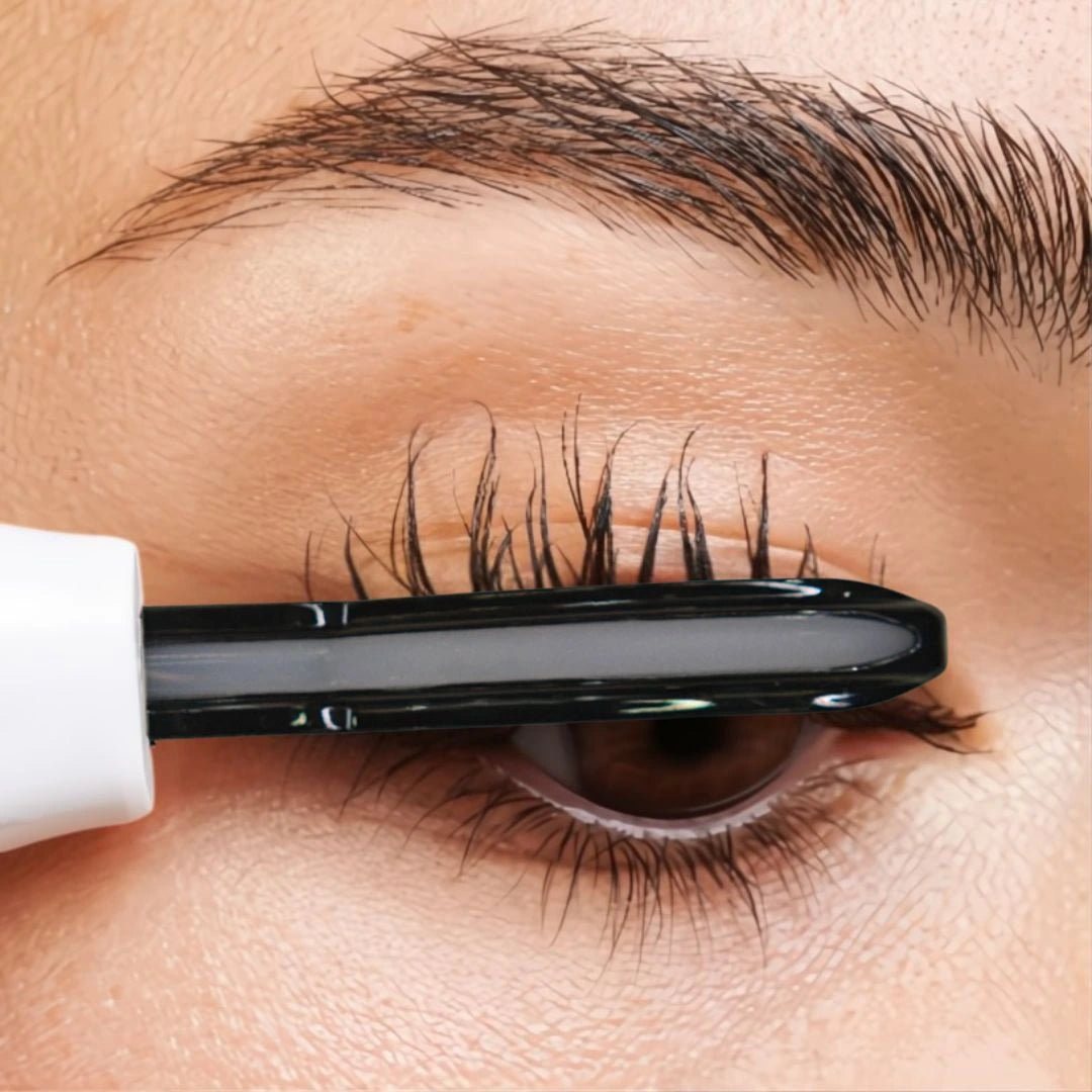 Position Ease heated lash curler at the base of lashes