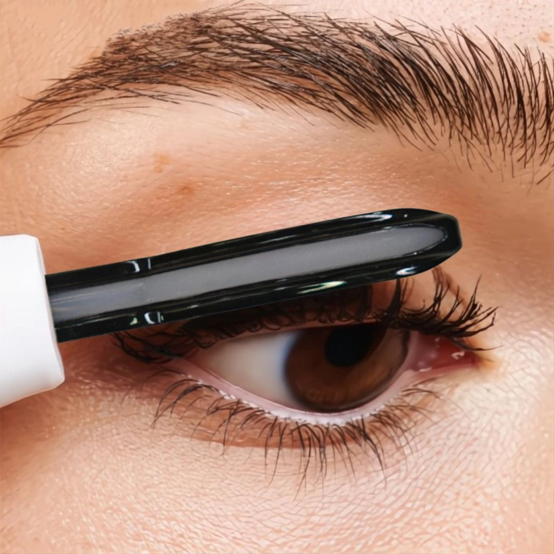 Gently lift and curl lashes upward using heated lash curler