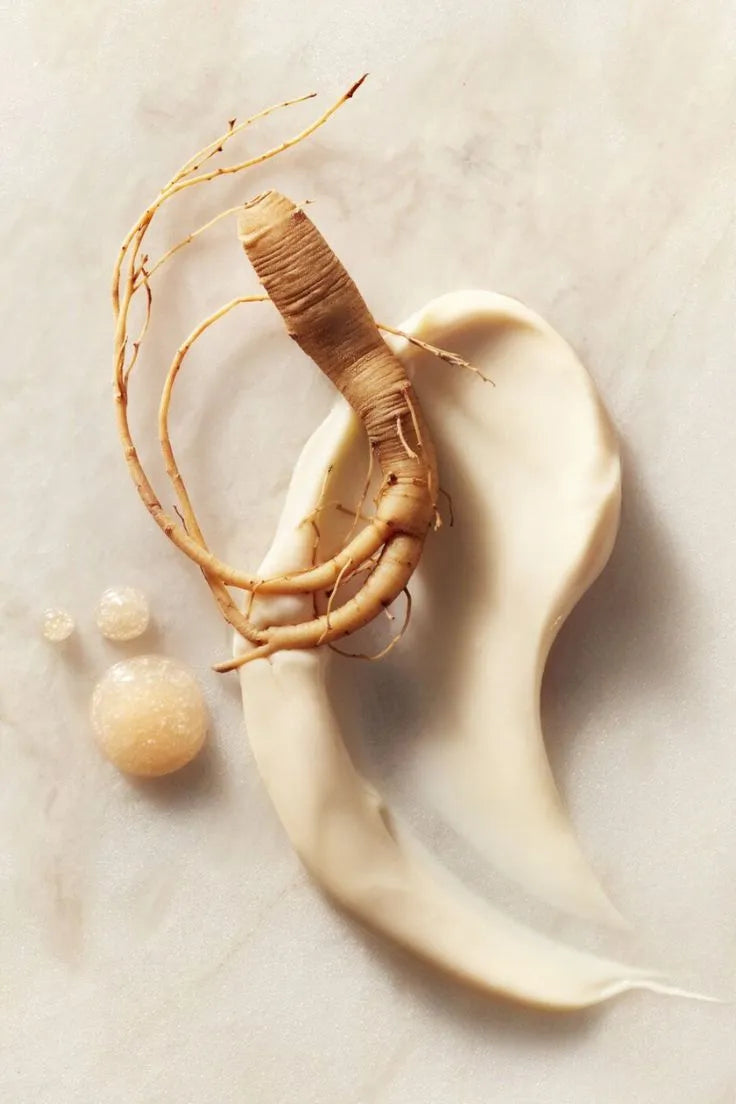 Ginseng root on a textured beige surface